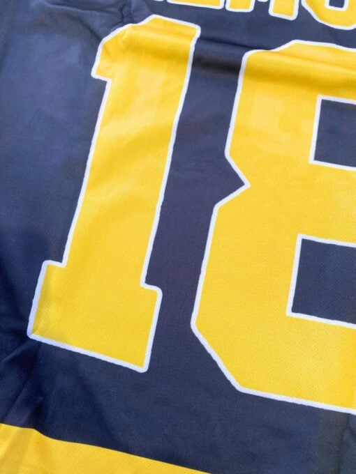 Happy Gilmore inspired black and yellow hockey jersey featuring number 18 and Boston text close up details